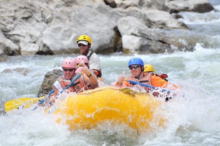 group rafting down rapids