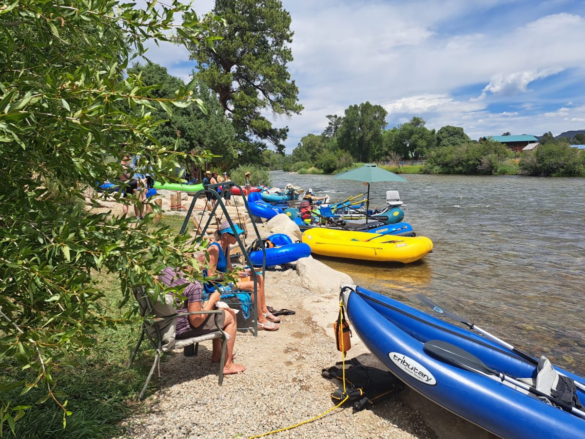 a group of people on a boat in the water